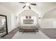 Comfortable and serene bedroom with a large bed, sitting area, and ample natural light at 9929 Musket Ridge Cir, Jonesboro, GA 30238