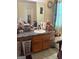 Bathroom with a vanity, single sink, framed mirror, and cluttered counter at 3464 Kingswood Trl, Decatur, GA 30034