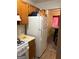 Practical kitchen with a refrigerator and an adjacent dining area, functional for everyday living at 3464 Kingswood Trl, Decatur, GA 30034