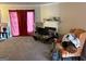 Cozy living room with carpet, fireplace, and large windows with curtains at 3464 Kingswood Trl, Decatur, GA 30034