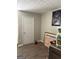 A room with laminated floors, white door and assorted art pieces at 3464 Kingswood Trl, Decatur, GA 30034