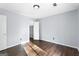 Bedroom features hardwood floors, closet, and light gray paint at 389 Rosser Rd, Mcdonough, GA 30252