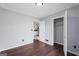 The bedroom reveals a glimpse into the kitchen area and has an open closet space at 389 Rosser Rd, Mcdonough, GA 30252