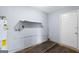 Utility room features a water heater, shelf, and door at 389 Rosser Rd, Mcdonough, GA 30252