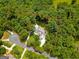 Expansive property surrounded by mature trees, featuring a circular driveway and lush landscaping at 135 Adams Park Dr, Fayetteville, GA 30214