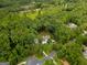 Aerial view of a home nestled among lush green trees in a serene setting at 135 Adams Park Dr, Fayetteville, GA 30214