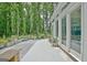 Beautiful backyard patio with stone bench and lush green backdrop at 135 Adams Park Dr, Fayetteville, GA 30214