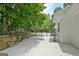 View of the backyard featuring a concrete patio and gated fence at 135 Adams Park Dr, Fayetteville, GA 30214
