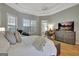 Comfortable primary bedroom features natural light, a ceiling fan, and an ensuite bathroom at 135 Adams Park Dr, Fayetteville, GA 30214