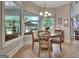 Cozy dining room boasts natural light with a beautiful view of the backyard at 135 Adams Park Dr, Fayetteville, GA 30214