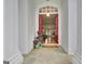 Inviting entryway with red doors, hardwood floors, and a welcome mat at 135 Adams Park Dr, Fayetteville, GA 30214