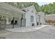 Beautiful white home with a fenced-in outdoor space and patterned brick driveway at 135 Adams Park Dr, Fayetteville, GA 30214