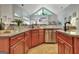 Well-equipped kitchen features stainless steel appliances, granite countertops, and wooden cabinets at 135 Adams Park Dr, Fayetteville, GA 30214