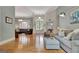 Open-concept living room with hardwood floors, stylish furniture, and great lighting at 135 Adams Park Dr, Fayetteville, GA 30214