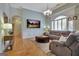 Bright living room with a large window, comfortable seating, and hardwood floors at 135 Adams Park Dr, Fayetteville, GA 30214