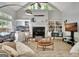 Inviting living room with fireplace, built-in shelving, and a vaulted ceiling at 135 Adams Park Dr, Fayetteville, GA 30214