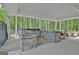 Covered outdoor kitchen featuring stone countertops and stainless steel appliances at 135 Adams Park Dr, Fayetteville, GA 30214