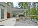 Outdoor living space with fireplace, benches, and patio furniture, perfect for entertaining at 135 Adams Park Dr, Fayetteville, GA 30214