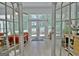 Bright sunroom with multiple windows, a cozy couch, and views of the outdoors at 135 Adams Park Dr, Fayetteville, GA 30214