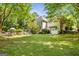 Spacious backyard with lush greenery, a soccer goal, and ample space for outdoor activities at 204 Clear Springs Ln, Peachtree City, GA 30269