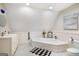 Bright bathroom with soaking tub, classic fixtures, and white wainscoting at 204 Clear Springs Ln, Peachtree City, GA 30269