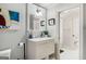 Charming bathroom boasts a white vanity and a decorative mirror over the sink at 204 Clear Springs Ln, Peachtree City, GA 30269