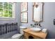 Charming powder room with decorative mirror, vessel sink, and beautiful art at 204 Clear Springs Ln, Peachtree City, GA 30269