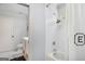 Bright, stylish bathroom with white subway tile shower and decorative black E shower curtain at 204 Clear Springs Ln, Peachtree City, GA 30269