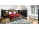 Bedroom featuring Georgia Bulldogs-themed decor, hardwood floors and neutral-toned walls at 204 Clear Springs Ln, Peachtree City, GA 30269