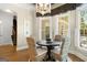 Cozy dining area with a round table, wicker chairs, and natural light at 204 Clear Springs Ln, Peachtree City, GA 30269
