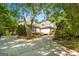 Exterior view of a house with stone and stucco accents, complemented by mature trees at 204 Clear Springs Ln, Peachtree City, GA 30269
