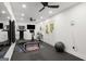 Bright home gym equipped with treadmill, bike, free weights, and mirrored wall at 204 Clear Springs Ln, Peachtree City, GA 30269