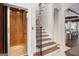 Elegant staircase and elevator enhance accessibility and add a touch of luxury to the home's interior at 204 Clear Springs Ln, Peachtree City, GA 30269