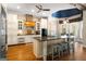 Spacious eat-in kitchen boasts large center island, white cabinetry and modern appliances at 204 Clear Springs Ln, Peachtree City, GA 30269