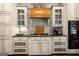 Well-appointed kitchen featuring custom cabinets, granite countertops and hardwood flooring at 204 Clear Springs Ln, Peachtree City, GA 30269