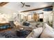 Open concept living room offering hardwood floors, comfortable seating and views of the kitchen at 204 Clear Springs Ln, Peachtree City, GA 30269