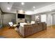 Comfortable living room with hardwood floors, fireplace, mounted TV, and modern decor at 204 Clear Springs Ln, Peachtree City, GA 30269