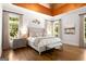 Bright main bedroom with tray ceiling, hardwood floors, and serene ambiance at 204 Clear Springs Ln, Peachtree City, GA 30269