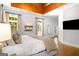 Bright and airy main bedroom with tray ceiling, hardwood floors, and serene ambiance at 204 Clear Springs Ln, Peachtree City, GA 30269
