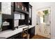 Well-lit home office with custom built-ins and unique door at 204 Clear Springs Ln, Peachtree City, GA 30269