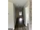 Hallway with hardwood floors and a light at 495 Mcgiboney Ln, Covington, GA 30016