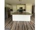 Kitchen with stainless steel appliances and a kitchen island at 495 Mcgiboney Ln, Covington, GA 30016