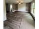 Empty living room with hardwood floors and a ceiling fan at 495 Mcgiboney Ln, Covington, GA 30016