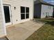 Concrete patio with a back door and a window at 495 Mcgiboney Ln, Covington, GA 30016