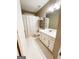 Well-lit bathroom with white cabinets, sink, toilet, shower, and neutral wall color at 110 Cedar Creek Ct, Fayetteville, GA 30215