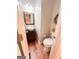Stylish half-bathroom with a vessel sink and ornate mirror at 110 Cedar Creek Ct, Fayetteville, GA 30215