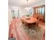 Dining room with wood floors, area rug, vintage hutch and chandelier at 110 Cedar Creek Ct, Fayetteville, GA 30215