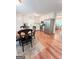 Bright eat-in kitchen boasts stainless steel appliances, white cabinetry, and adjacent dining area at 110 Cedar Creek Ct, Fayetteville, GA 30215
