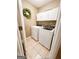 Functional laundry room with a washer, dryer, and decorative wreath at 110 Cedar Creek Ct, Fayetteville, GA 30215