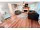 Inviting living room features a fireplace, ceiling fan, and staircase access at 110 Cedar Creek Ct, Fayetteville, GA 30215